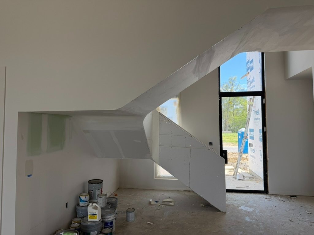 Finished residential stairwell drywall