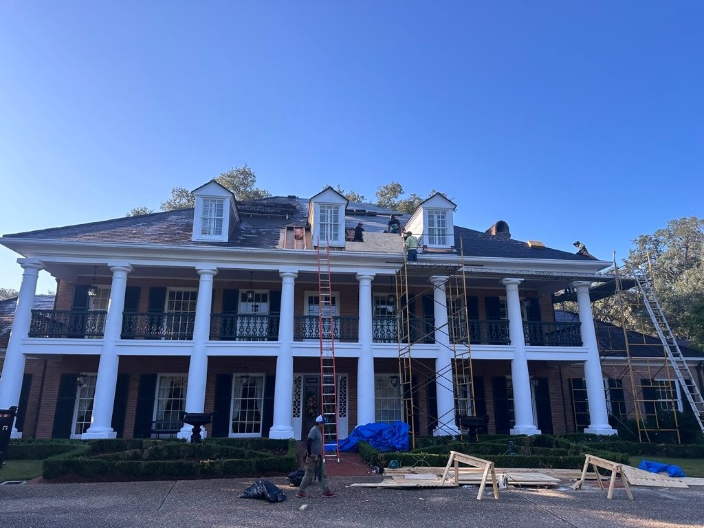 Reform Construction crew restoring a two-story Greek Revival home in Louisiana