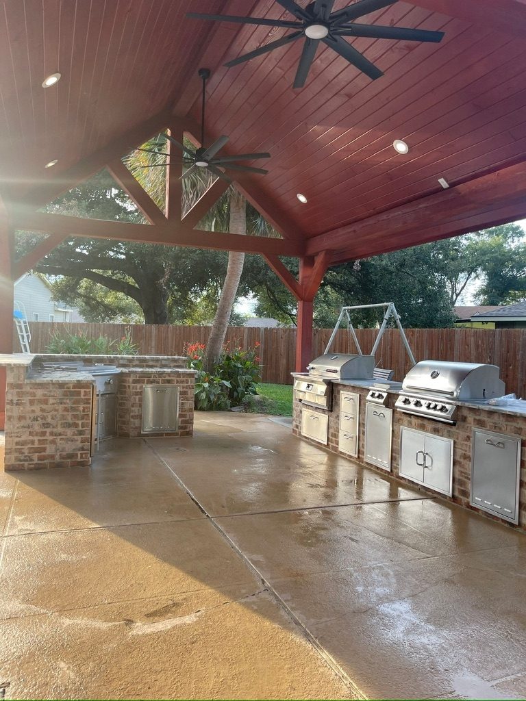 Outdoor kitchen with cathedral ceiling and grill