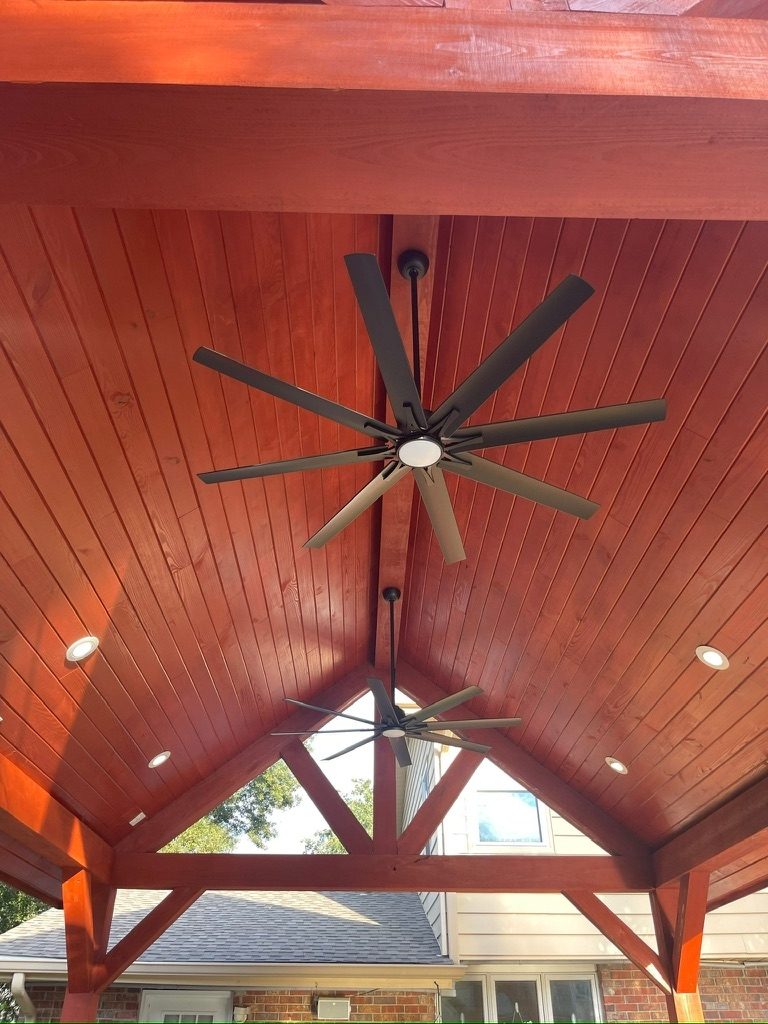 Vaulted red beam ceiling with ceiling fan